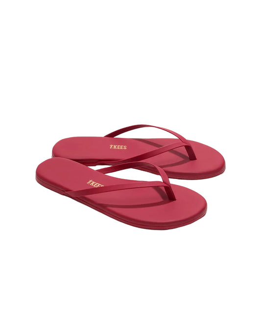Red flip-flops with a brand logo on a white background