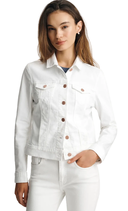 Woman wearing a white denim jacket with brown buttons on a light gray background