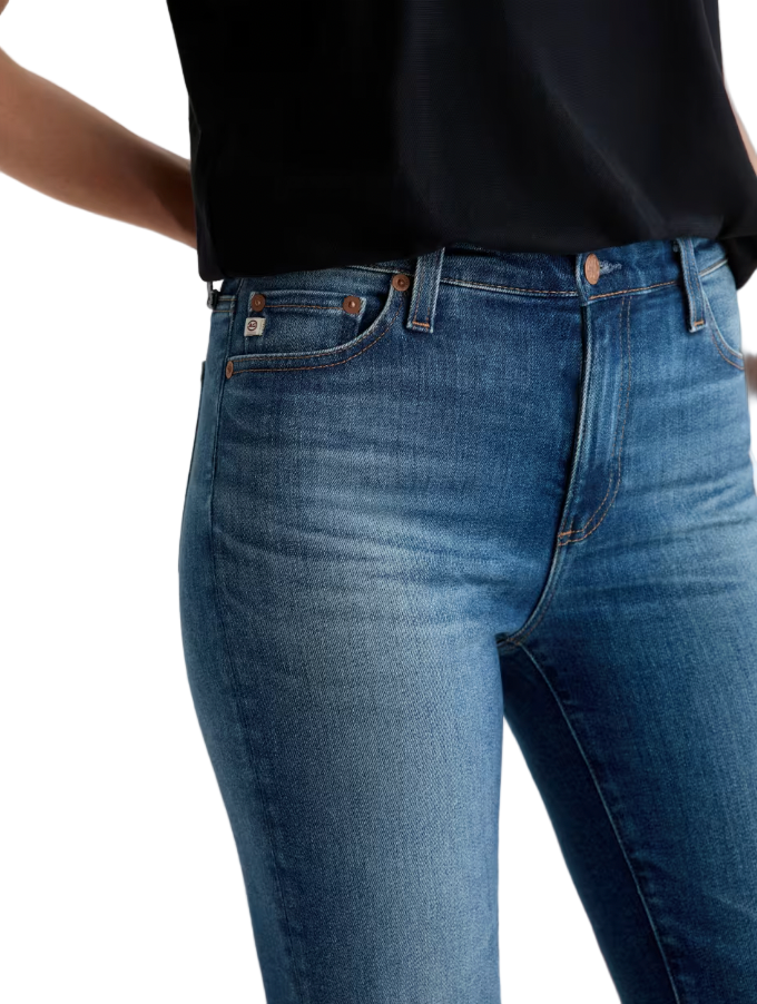 Close-up of fabric and hem detail – detailed shot of vintage indigo stretch denim and busted hem.