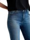 Close-up of fabric and hem detail – detailed shot of vintage indigo stretch denim and busted hem.
