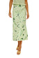 Person wearing a light green floral skirt on a plain background