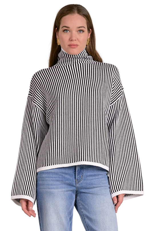 Front view of drop shoulder stripe sweater – black and white striped knit with relaxed fit and long sleeves.